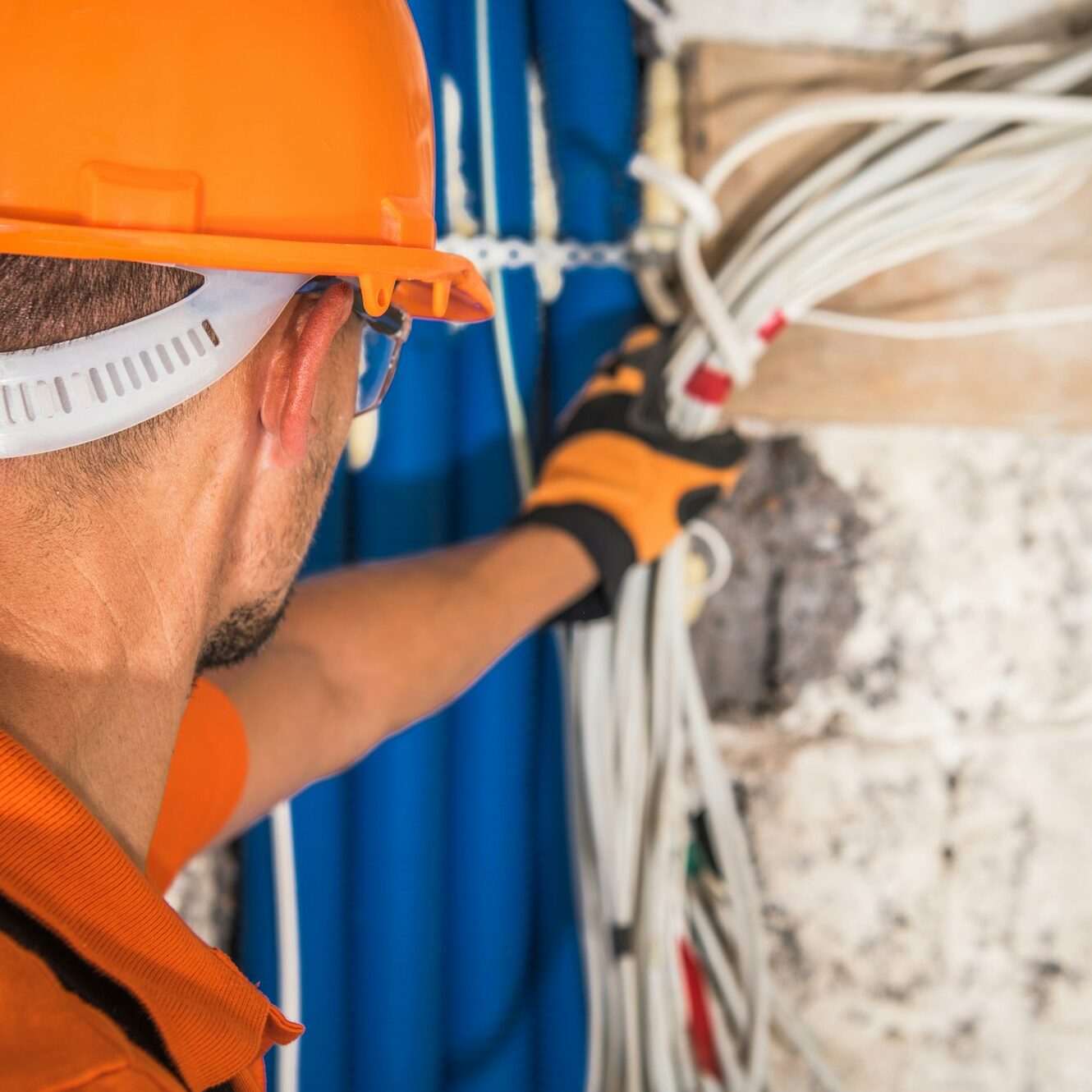 Construction Contractor Looking Inside Electrical Installation